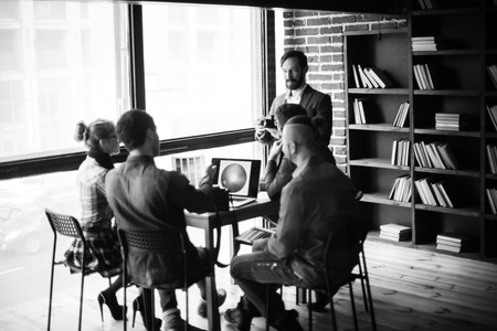 group of creative designers discuss the color palette in a moder
