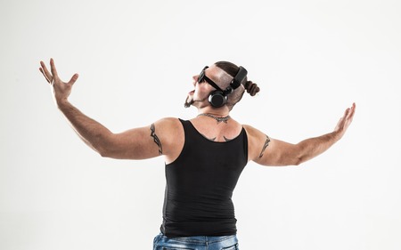 back view - emotional bodybuilder with headphones and sunglassesの写真素材