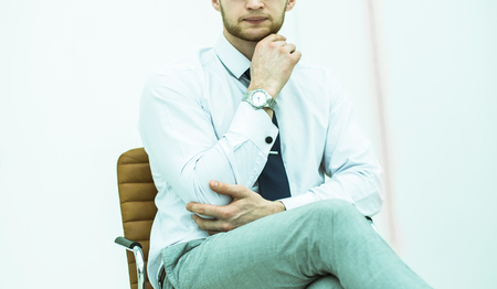concept of business success - businessman sitting on a chair inの写真素材