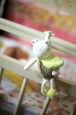 bed for newborn baby with baby toys and sleep in it babyの写真素材