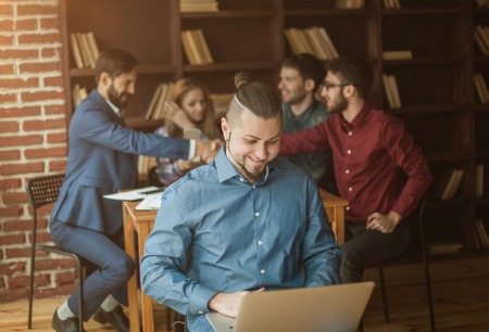 advertising Manager with laptop on background of business partneの写真素材