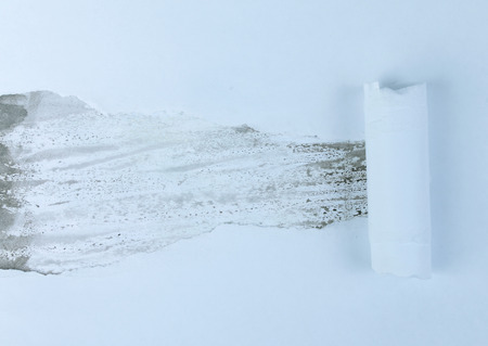 A torn piece of paper on a background multicolored sheet of paper, perfect for your textの写真素材