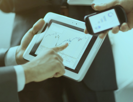 Hands of people working with tablet computerの写真素材
