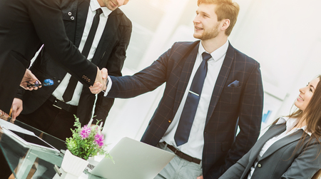 handshake of business partners after signing the contract in theの写真素材