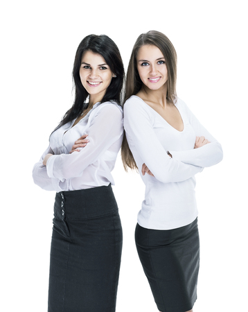 Two young successful attractive business woman isolated white backgroundの写真素材