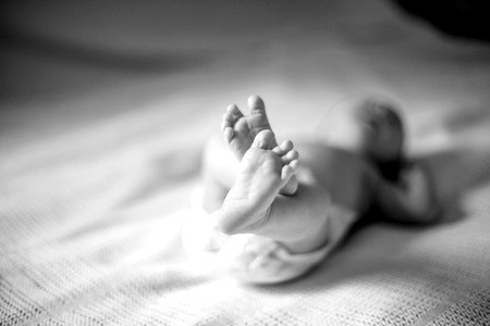 black-and-white photo.health concept - closeup of legs of a newbの写真素材
