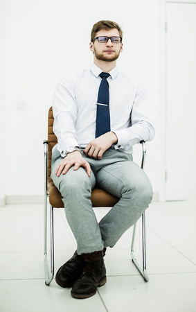 concept of business success - businessman sitting on a chair inの写真素材
