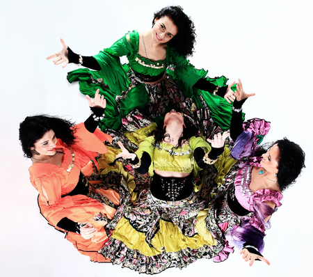 professional Gypsy dancing group in national costumes performing folk dance.