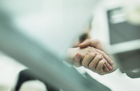 concept of reliability and partnership: a handshake of businessの写真素材