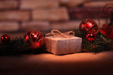 Christmas present on the background of Christmas decorationsの写真素材