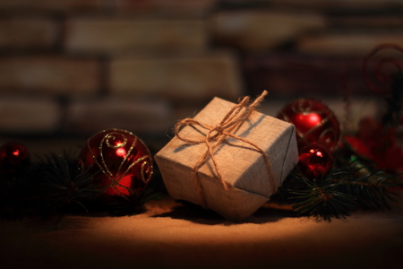 Christmas present on the background of Christmas decorationsの写真素材