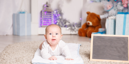 Portrait of four - month-old happy child in the nursery