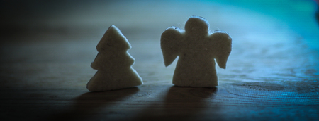 .gingerbread figures Christmas tree and an angel on the woodenの写真素材