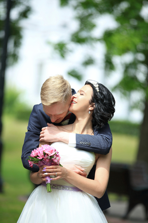 Bride and groom at wedding Day walking Outdoors on spring nature.の写真素材