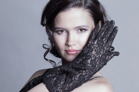 portrait of stylish young woman.isolated on gray backgroundの写真素材