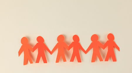 four paper men taking each others handsの写真素材