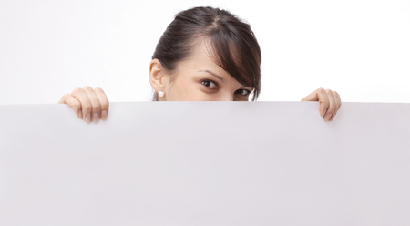 young business woman showing blank posterの写真素材