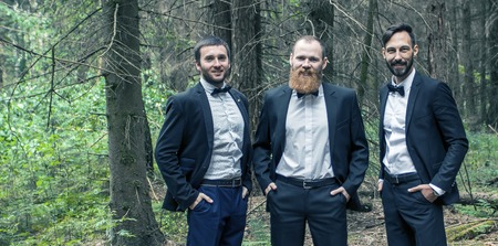 portrait of three business partners on the background of the forest.の写真素材