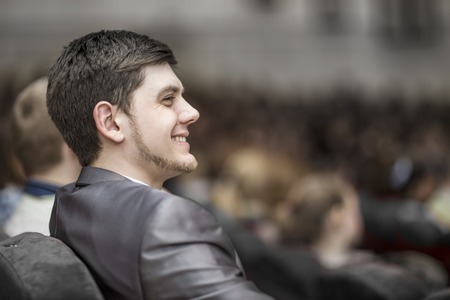closeup of a young successful businessman on a business conference, sitting in the conference roomの写真素材
