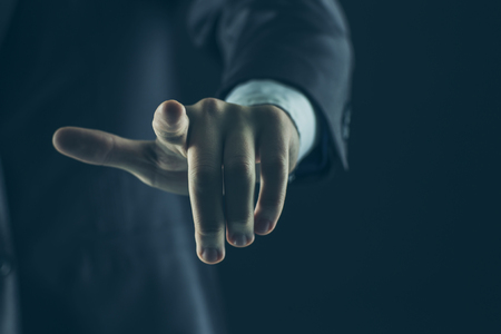 concept of success in business:businessman pointing his finger forwardの写真素材
