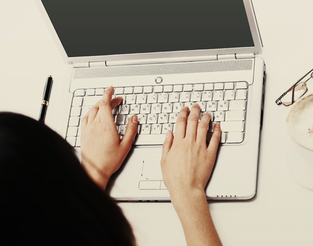 The female hands print on the keyboard the computerの写真素材