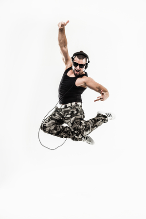 emotional and charismatic DJ - rapper in headphones takes the raの写真素材