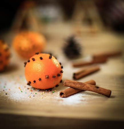 Christmas table. background image oranges and cinnamon sticks oの写真素材