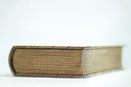 close up.thick closed book on white backgroundの写真素材