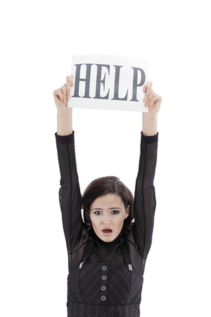 upset young business woman asking for help.の写真素材