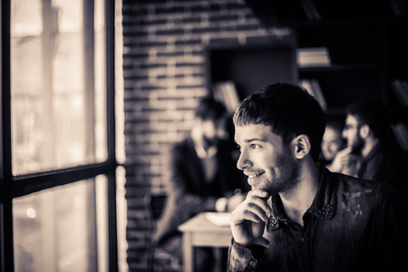 portrait of an employee of the company on the background of businessの写真素材