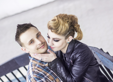 concept of happiness:lovely couple hugging, standing on the terraceの写真素材
