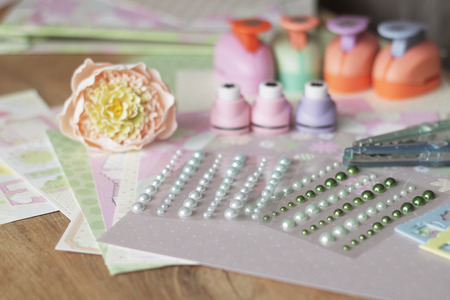 set for needlework on wooden table.