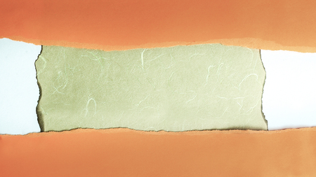 background .orange torn paper on white cardstockの写真素材