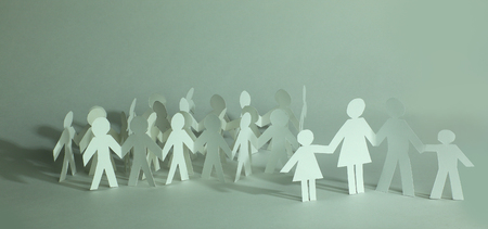many paper men on the paper backgroundの写真素材