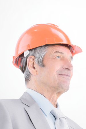 closeup.portrait of confident senior engineer .isolated on a whiteの写真素材