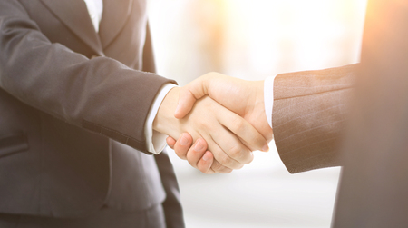 Handshake businessmen in the officeの写真素材