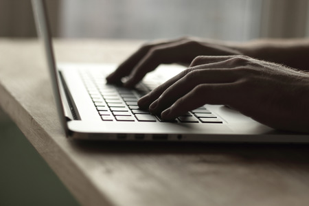 close up. businessman typing on laptop keyboard