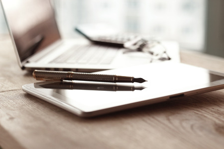 close up.stylish fountain pen on blurred workplace backgroundの写真素材