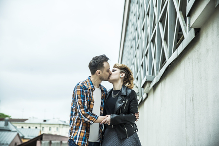 love couple kissing on the street of a modern city.の写真素材