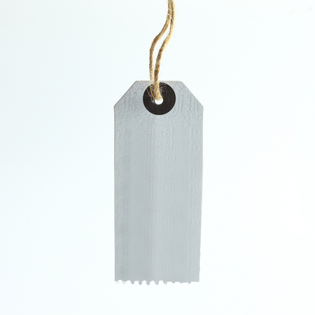 blank cardboard tag on a white background.の写真素材