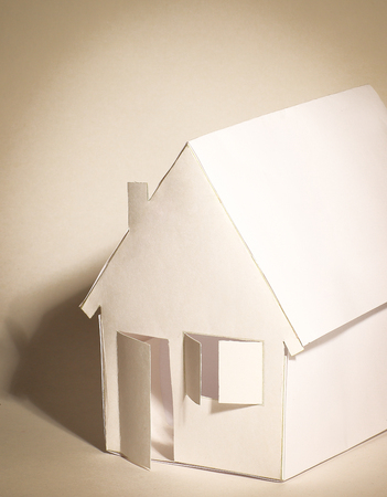 paper house paper background.the concept of a mortgageの写真素材