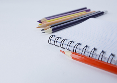 close up.Notepad and pencils on white background .photo with copy space.backgroundの写真素材