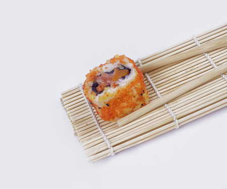 large sushi and chopsticks .isolated on a lightの写真素材
