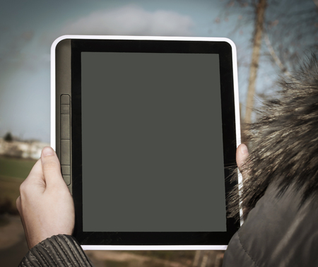 Close up hand woman holding tablet on isolated.の写真素材