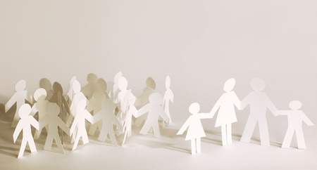 many paper men on the paper backgroundの写真素材