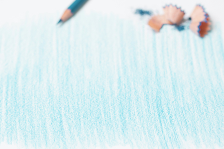 stripes painted with a blue pencil on a white sheet.の写真素材