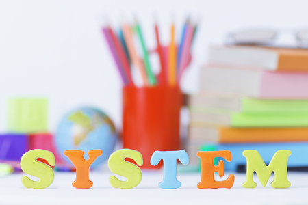 word system on blurred background of school supplies .photo with copy spaceの写真素材