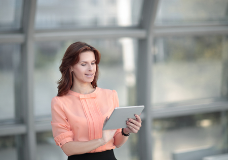 modern business woman typing text on a digital tablet.の写真素材