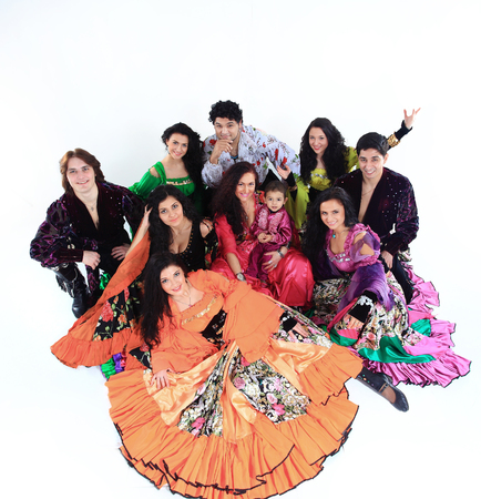 portrait of a Gypsy dance group with a little boy dancer in traditional costumesの写真素材