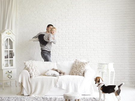 loving father playing with daughter in the living room.の写真素材